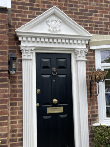 Exterior plasterwork at a private residents in London consisting of a a new capital and beautifully fluted pilasters.
