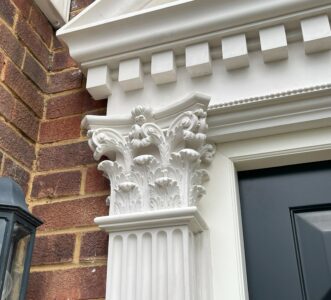 Exterior plasterwork at a private residents in London consisting of a a new capital and beautifully fluted pilasters.